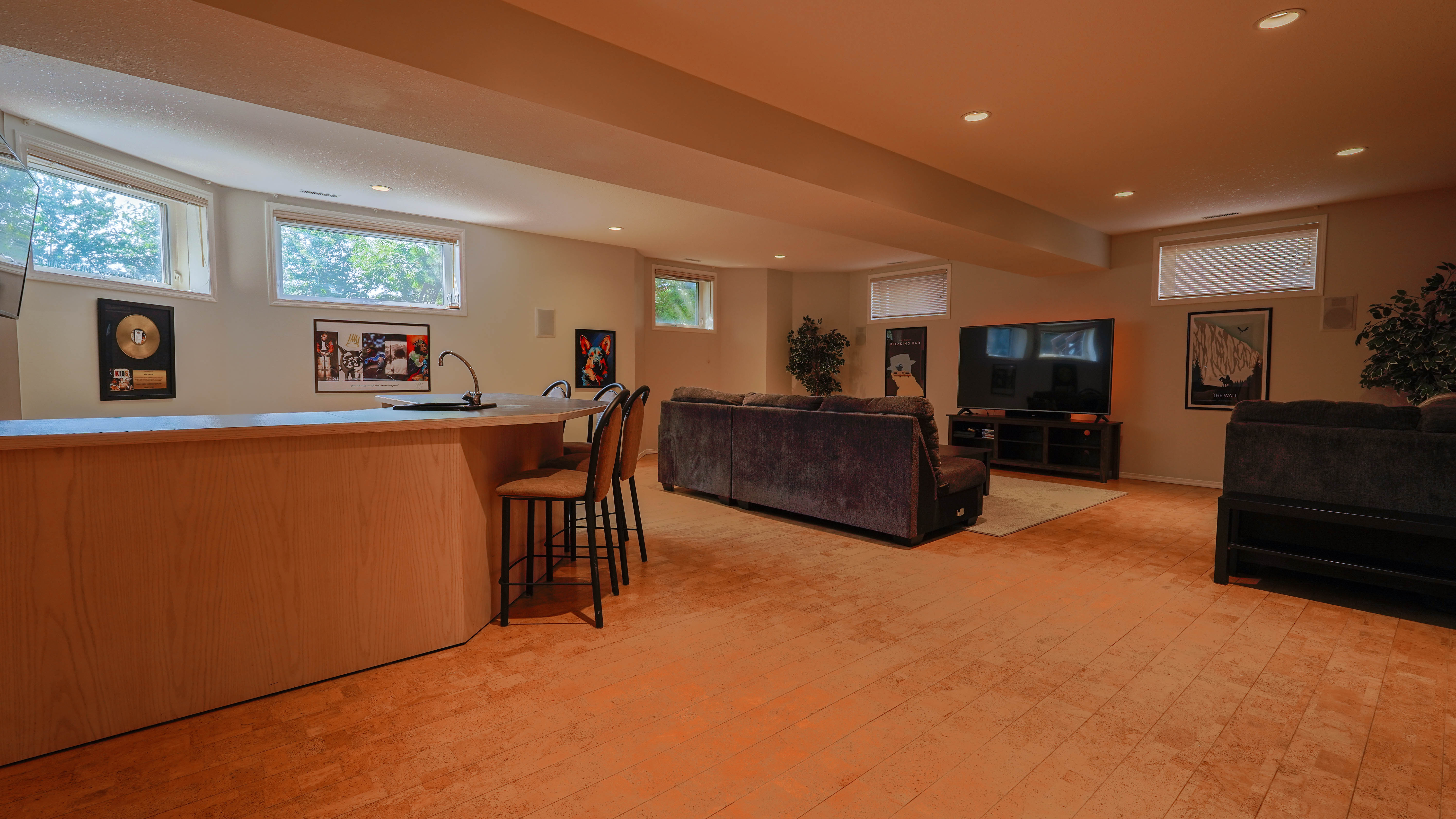 Basement rec room with wet bar and seating