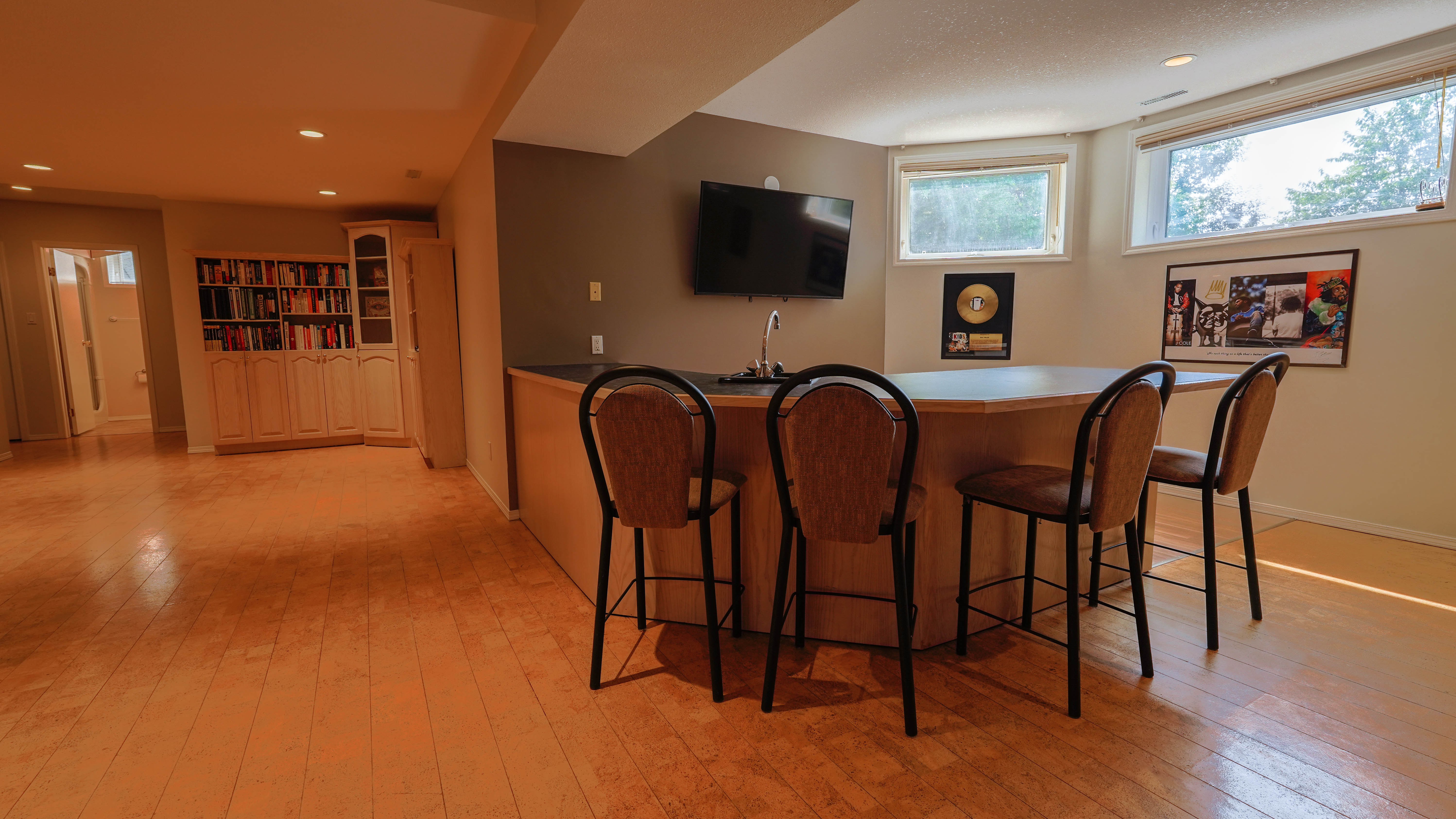 Finished basement recreation room with large bar
