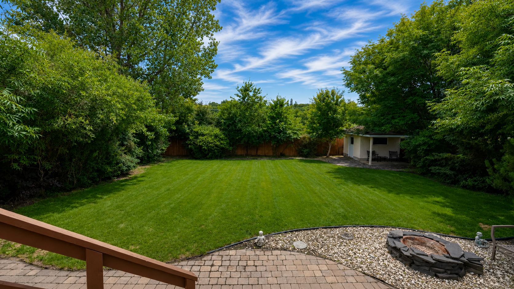 Expansive backyard lawn backing onto greenspace